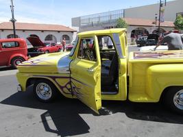 Yellow pickup truck with blue flames painted on side