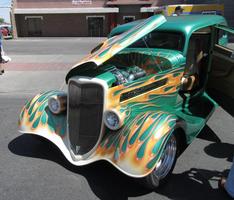 Classic car in yellow, blue, and green teardrop paint