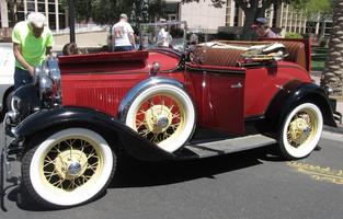 Red model-T-like car.