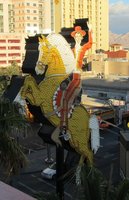 Horse and rider sign; neon/incandescent
