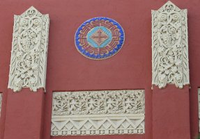 closeup of carving and Indian design on high school façade
