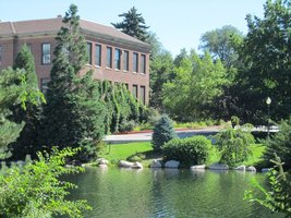 Another view of lake; brick building in background