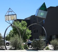 Two glass houses mounted on large hoops