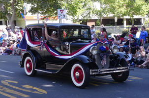 Antique black car with bunting