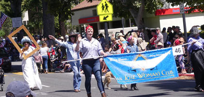 Women in period dress (suffragette, Rosie the Riveter)