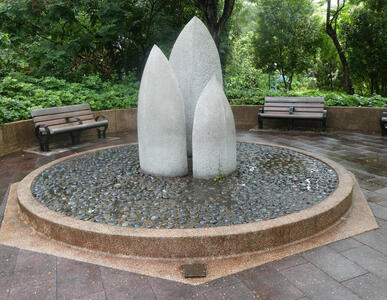 three toothlike marble columns in circluar base