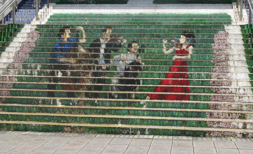 Staircase where sides of steps are painted; when viewed from distance,, shows a string quartet.