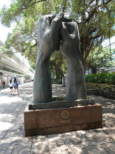 large sculpture of human hands