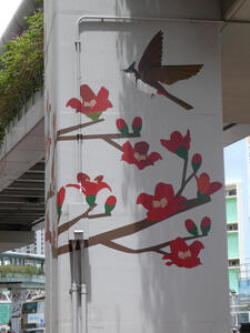Support column painted with bird and flowering branches