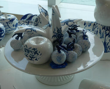 porcelain fruit and origami crane