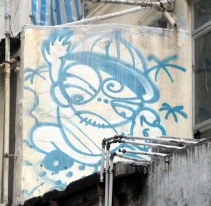 graffiti man in baseball cap