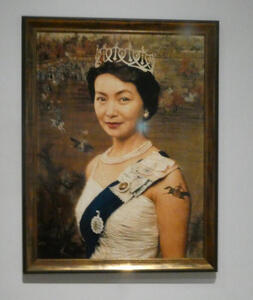 asian woman dressed as queen elizabeth