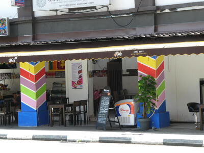 multicolor painted V on building columns