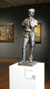 statue of man with hand on chin