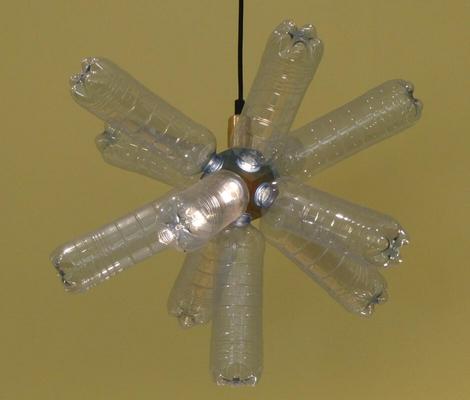 Lamp made of ten plastic water bottles arrayed around a core