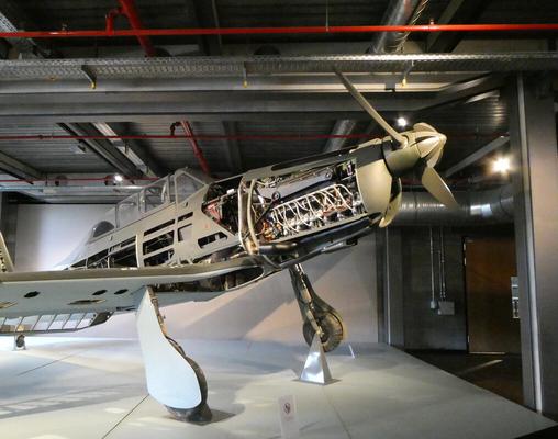 Propeller plane with side panels removed so you can see the inner mechanisms