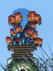 Orange flowers on top of sign for California Theatre