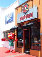 Statue of cartoonish “devil” mascot of Chamuco clothing company
