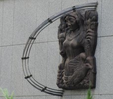 Sculpture of a woman on bridge over Chicago River