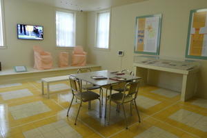 Staff dining room with plain table and metal frame chairs