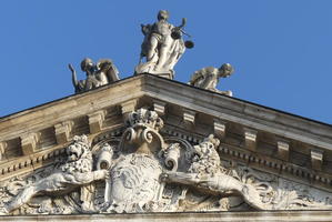 Justice holding scales (top of building)