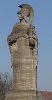 side view of statue of woman in helmet