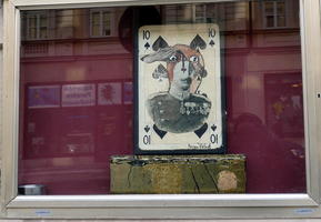 10 of spades overlaid with person in military uniform