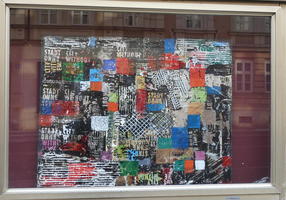 Abstract piece with various colored rectangles and words “City Without” / “Stadt ohne” repeated at intervals.