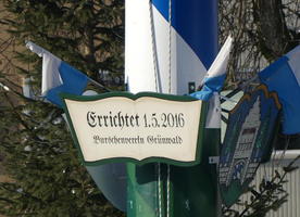 Dedication on blue and white striped pole