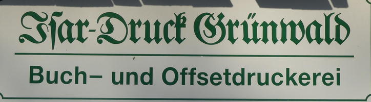Sign with fraktur on top and sans-serif below
