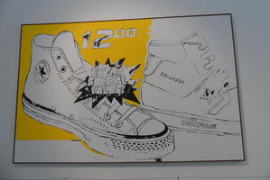 Painting of Converse sneaker advert, partial yellow background