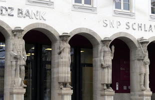 medieval-looking statues at bank