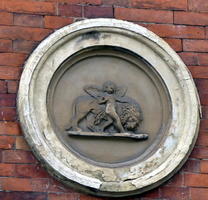 carving of cherub and lion