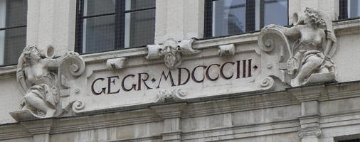 Engraved “GEGR MDCCCIII” with sculpted woman on either side