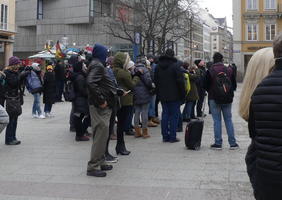 People with cameras ready to take pictures of clockwork