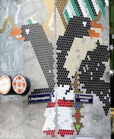 mosaic of birds on two corners of a building