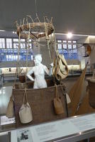 Female mannequin in balloon wicker basket