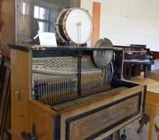 large music box (paino sized) with drum on top