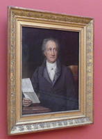 Man looking to side, piece of paper in hand