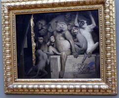 Group of monkeys sitting on a crate