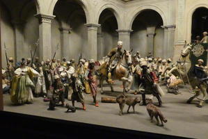 Crowd scene with men on horseback; all in middle east dress