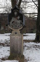 Grave with carved Mary and Jesus