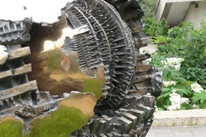 Closeup of bronze spherical sculpture