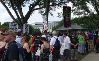 Jesus people counter-protesting and holding posters