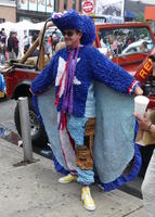 Man in blue outfit with cape