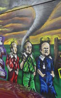 Angry-looking Munchkins (from Wizard of Oz movie) with tornado in background