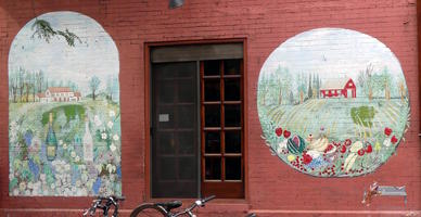 Painting of wine and garden on building wall