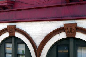 Keystones on arched windows with years 1873 and 1906