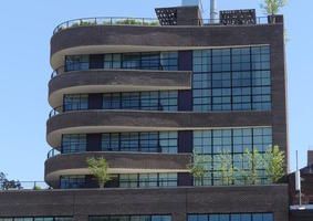 Building with balconies that curve around the outside of the building