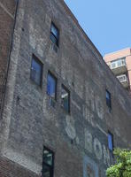 Faded painting on brickwork possibly reading WARERO INC U. S. BOND